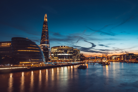 Banks of river Thames in London at sunsetの写真素材