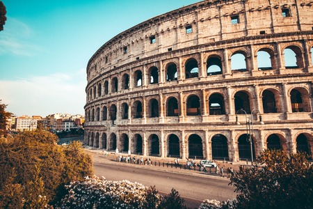 The ancient Colosseum in Rome at sunsetの写真素材