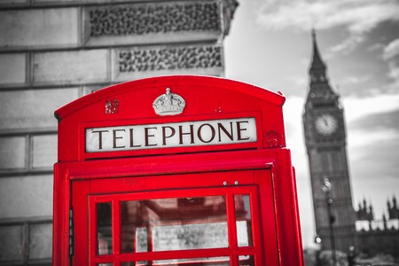 Londons iconic telephone booth with the Big Ben clock tower in the backgroundの写真素材