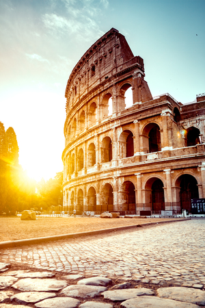 The ancient Colosseum in Rome at sunsetの写真素材