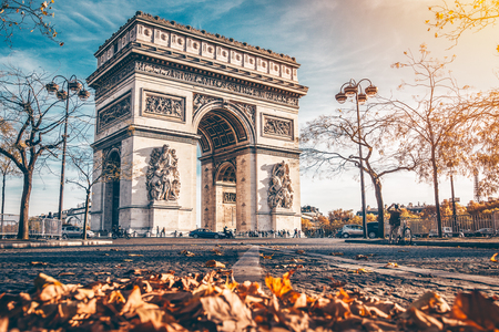 Arc de Triomphe located in Paris, in autumn scenery.の写真素材