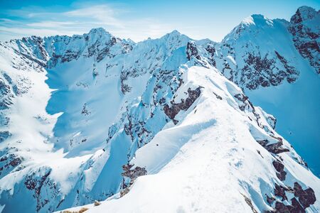 Spectacular landscape of snowy mountains in winterの写真素材