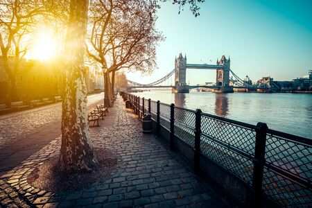 A boulevard next to the river Thames with Tower Bridge in the distanceの写真素材