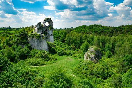 A panoramic view of the unique Okiennik rock in Poland with a large natural windowの写真素材