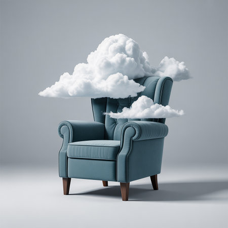 A teal upholstered armchair with a tufted back is positioned on a light gray surface. Several soft, white, fluffy clouds are floating around and above the chair, creating a surreal and dreamlike atmosphere. The lighting casts subtle shadows.の素材