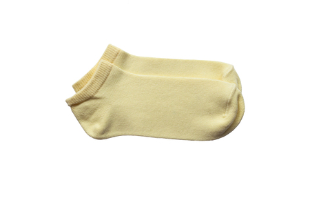 Yellow socks isolated on a white backgroundの写真素材