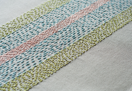 Rustic multicolor embroidery background.の写真素材