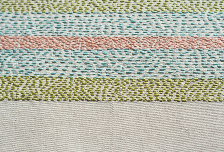 Rustic multicolor embroidery background.の写真素材