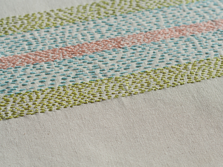 Rustic multicolor embroidery background.の写真素材