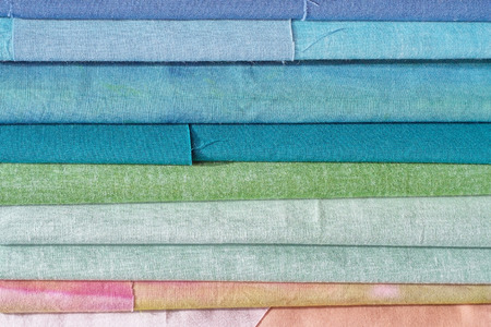 Rolls of textile, cloth and tissue of various colours, backgroundの写真素材