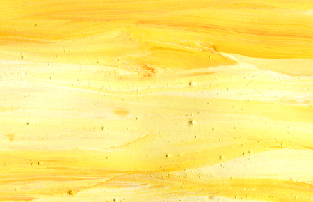 Yellow hand painted acrylic background, abstract textureの写真素材