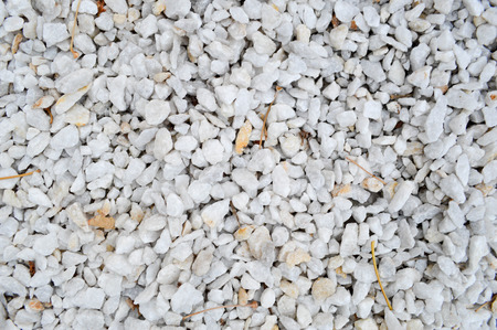 white stones with leaves and twigs, backgroundの写真素材