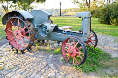 very old retro tractor with metal wheelsの写真素材