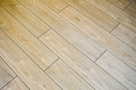 Brown boards with black seams, background, texture. Tilt to the left.