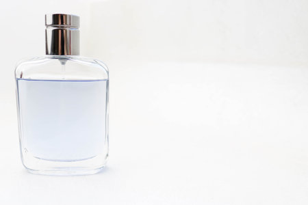 Blue rectangular beautiful glass transparent shiny fashionable glamorous bottle of cologne, perfume...