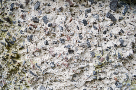 Concrete gray old stone sharp texture with shards of various stones of different shapes background