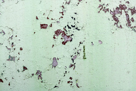 Texture of rusty two-color reddish and green old shabby oxidized metal, iron with bulbted peeling and green paint and patterns, background.の写真素材
