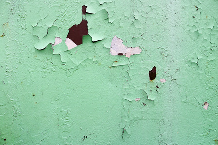 Texture of rusty two-color reddish and green old shabby oxidized metal, iron with bulbted peeling and green paint and patterns, background.の写真素材