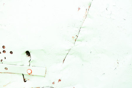 The texture of the old shabby oxidized metal, iron with the expanded peeling green peeling paint and patterns, the background.の写真素材