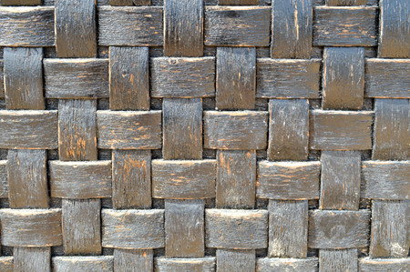 checkered dark blue-black convex wooden plaid geometry texture ragged old wicker handmade decorative homogeneous backgroundの写真素材