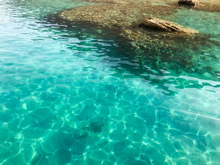 The texture is transparent wet blue light iridescent sea salt water, sea, ocean with waves, ripples...