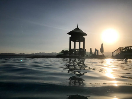 Rescue booth, tower, rescue post on the edge of the pool-infinity water merging with the horizon on...