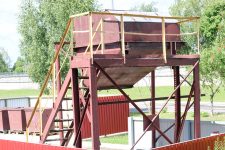 Large industrial brown waste collection bin, trash bins at an industrial plant.