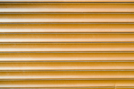Texture of wooden unpainted old boards with seams, cracks and nail caps. The background.の写真素材