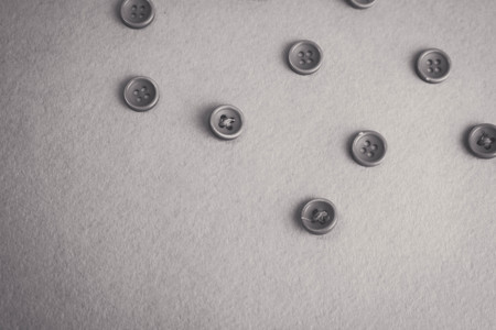 Beautiful black and white texture with a lot of round buttons for sewing, needlework. Copy space. Flat lay. The background.の写真素材