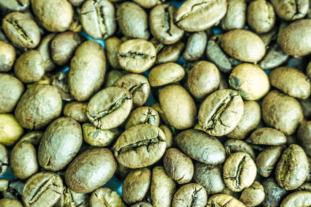 Beautiful texture of freshly roasted selected delicious rich brown natural fragrant coffee tree grains, Arabica coffee beans, Robusta. Flat lay and copy space. The background.の写真素材