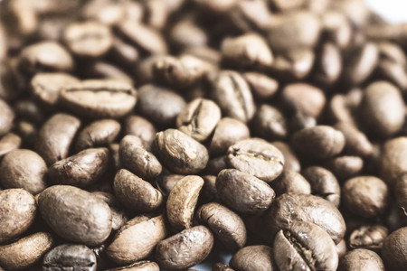 Beautiful texture of freshly roasted selected delicious rich brown natural fragrant coffee tree grains, Arabica coffee beans, Robusta. Copy space, background.の写真素材
