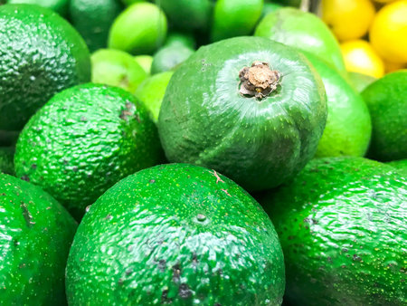 Beautiful green exotic natural sweet tasty ripe soft round big bright bright avocados. Texture,...