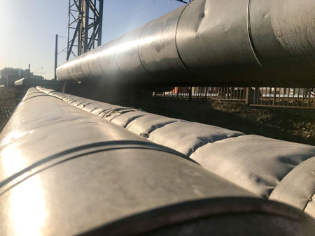 Large thick metal pipes for pumping liquids, water, steam, oil, liquefied gas in thermal insulation...