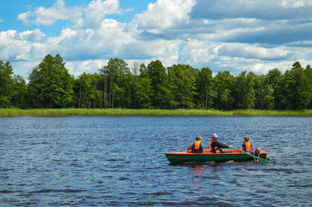 People ride on a boat speedboat rest travel on water on the background of the beautiful nature of...