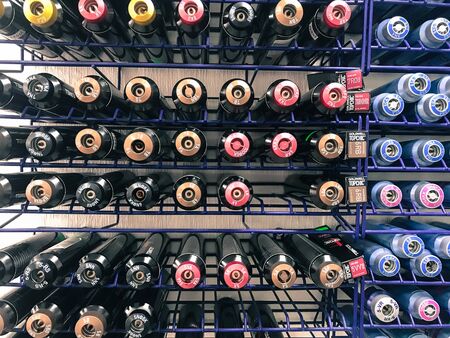 A lot of multi-colored metal cylinders with paint for coloring hair of all colors and palettes in a beauty salon. The background. Texture. Minsk Belarus July 8, 2019.のeditorial素材
