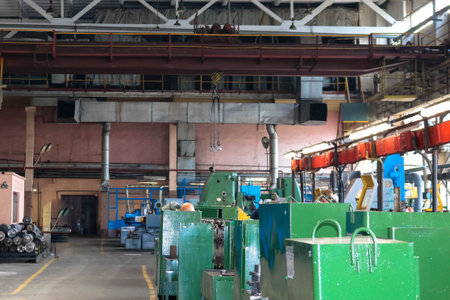 A large industrial workshop inside the building with machine tools and a warehouse with tools for...