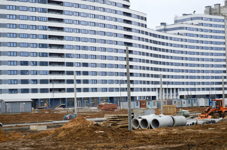 Large concrete cement modern under construction new modern monolithic frame-block house building...