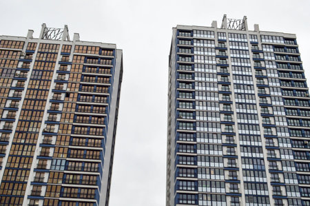 New modern tall blue glass multi-storey comfortable urban monolithic frame houses buildings...