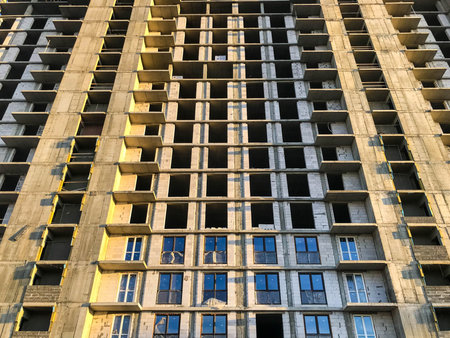 demolition of a new quarter. there is an unfinished building on the road, there are no windows and...