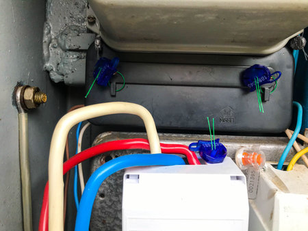 homemade electrical panel. meter for the transmission of electricity. blue and red cables are woven...