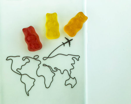 gummy bears are going to travel the world. bears fly on vacation and examine the map. the journey of...
