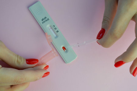 Rapid COVID-19 antibody test for IgM and IgG antibodies to novel coronavirus SARS-CoV-2, Covid-19 viral pneumonia. Medics hand in glove holds the test.の写真素材