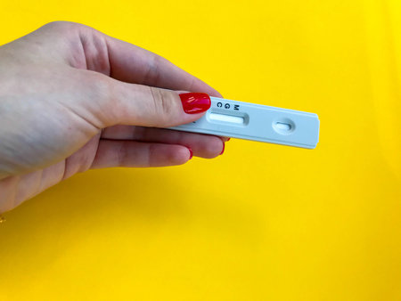 Coronavirus COVID-19 quick Rapid Diagnostic Test RDT, medical worker place collected patient finger...