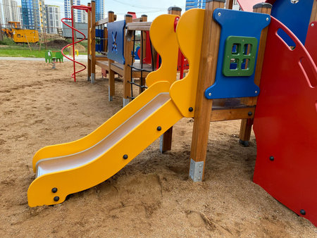 New bright children's playground in the courtyard of the new building.