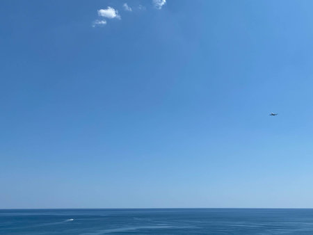 A Beautiful Blue Sky With Clouds And Blue Ocean.