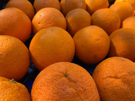 Fresh tangerines on a market stall.