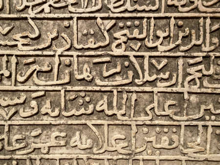 Large rusty old anchor on rocky sea shore.の写真素材