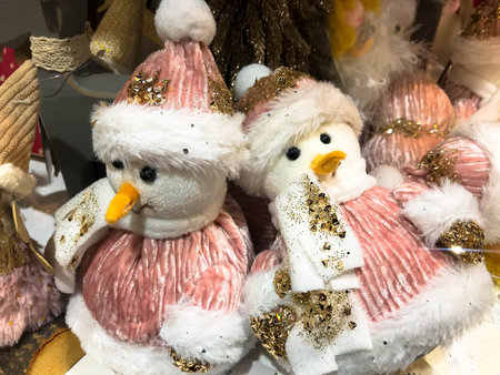 Close-up of snowman in foreground, Christmas holiday background concept with toys, decorations, ornaments.の写真素材
