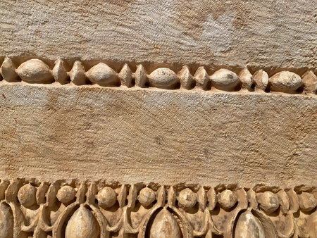 Old Beige Wall Covered With Decorative Plaster. Texture Of Vintage Sand Stone Background, Closeup.の写真素材