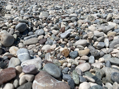 Abstract background texture, Colorful sea stones background. gray and beige mixed color river pebble...